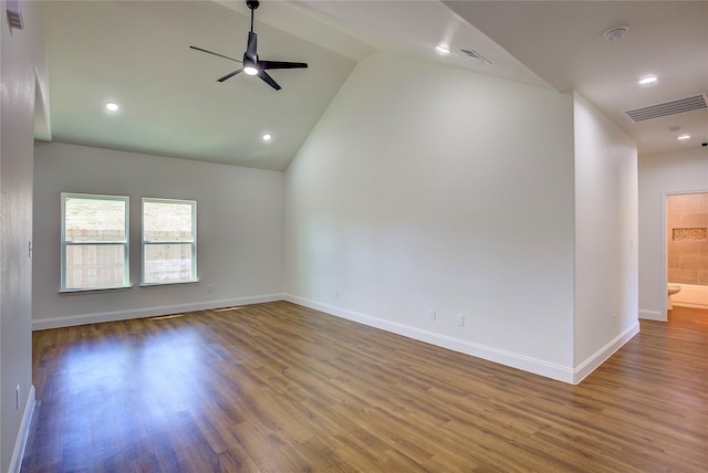 unfurnished room featuring dark wood-type flooring, visible vents, baseboards, and a ceiling fan