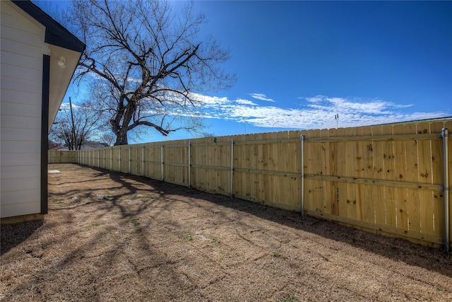 view of yard with a fenced backyard