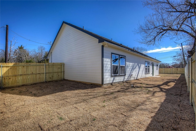 view of property exterior featuring fence