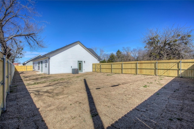 view of yard featuring a fenced backyard and central air condition unit