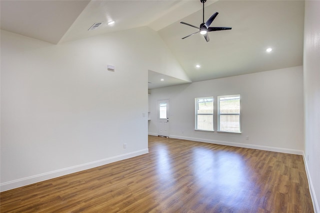 unfurnished room with ceiling fan, high vaulted ceiling, wood finished floors, visible vents, and baseboards