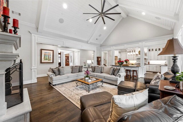 6611 Dartbrook Dr, Dallas, TX 75254 - living area with beamed ceiling, dark wood-style flooring, a ceiling fan, high vaulted ceiling, and a fireplace