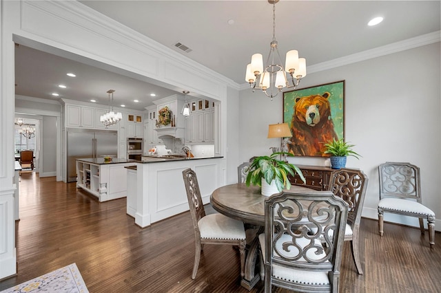 6611 Dartbrook Dr, Dallas, TX 75254 - dining room featuring a chandelier, crown molding, dark wood finished floors, recessed lighting, and baseboards