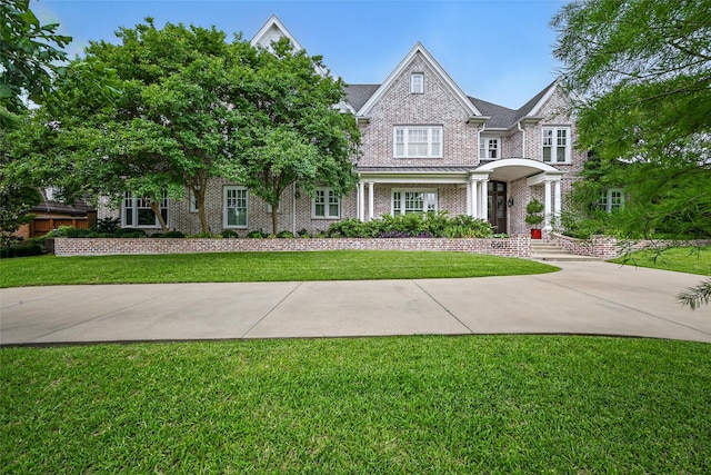 6611 Dartbrook Dr, Dallas, TX 75254 - view of front of house featuring a front yard and brick siding
