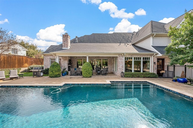 6611 Dartbrook Dr, Dallas, TX 75254 - view of swimming pool with a patio and area for grilling