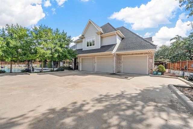6611 Dartbrook Dr, Dallas, TX 75254 - townhome / multi-family property featuring brick siding, driveway, and a shingled roof