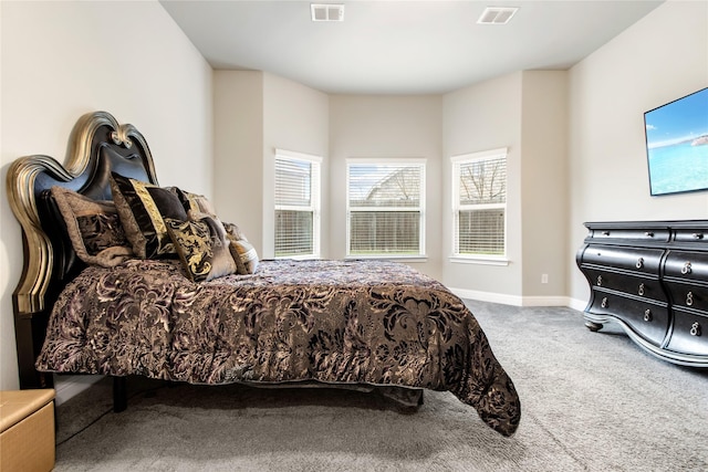 bedroom featuring carpet, visible vents, and baseboards