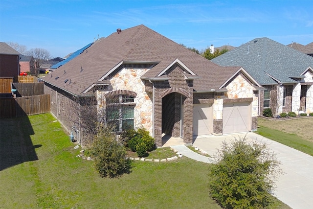 french country style house featuring brick siding, a shingled roof, concrete driveway, fence, and a garage