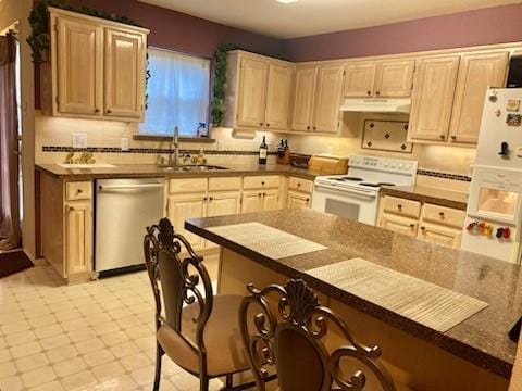 kitchen featuring white range with electric cooktop, dishwashing machine, under cabinet range hood, light brown cabinets, and a sink