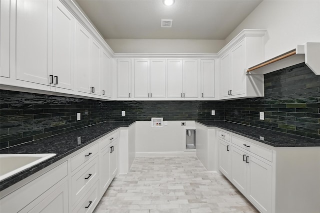 201 Rio Rancho Dr, Decatur, TX 76234 - kitchen featuring decorative backsplash, white cabinets, and dark stone countertops