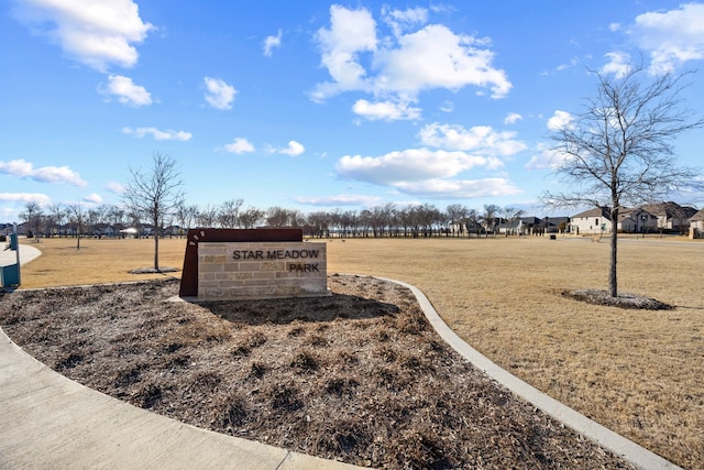 surrounding community featuring a lawn