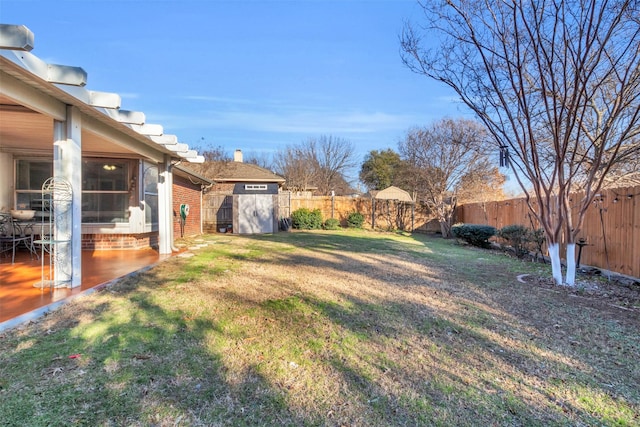 view of yard with a fenced backyard