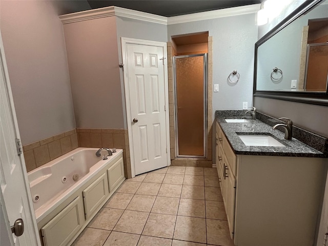 full bathroom with tile patterned flooring, a sink, a whirlpool tub, and double vanity