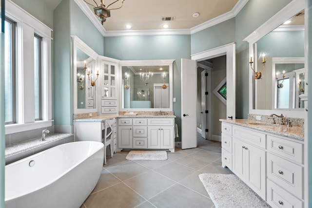 full bath featuring ornamental molding, a sink, visible vents, and tile patterned floors