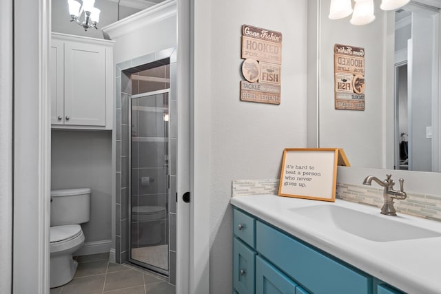 full bath featuring tasteful backsplash, toilet, a stall shower, vanity, and tile patterned floors