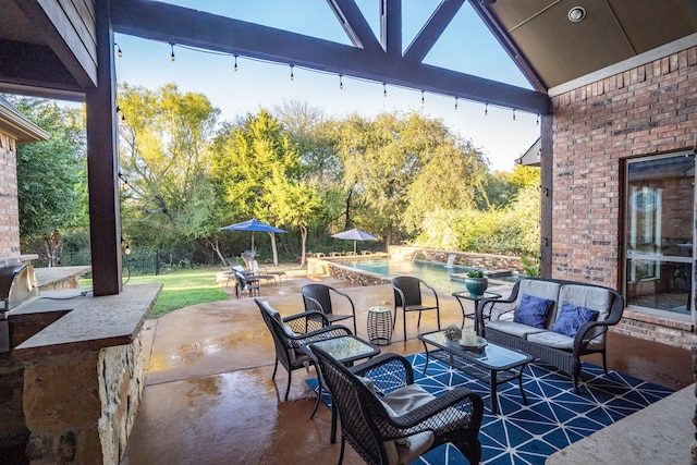 view of patio / terrace featuring an outdoor pool and outdoor lounge area