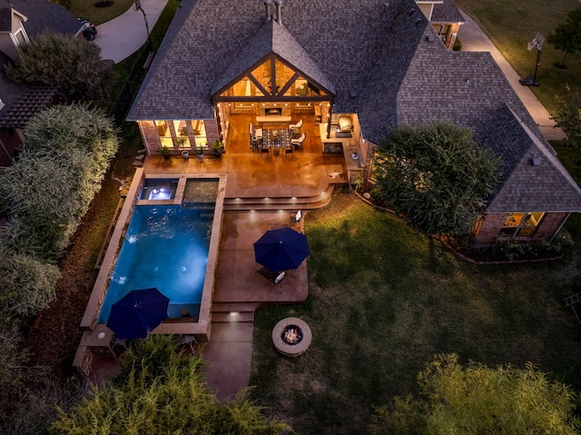 view of pool with an outdoor living space with a fire pit, a patio, an in ground hot tub, a yard, and outdoor dining space