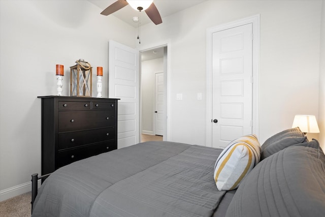 bedroom featuring light carpet, ceiling fan, and baseboards