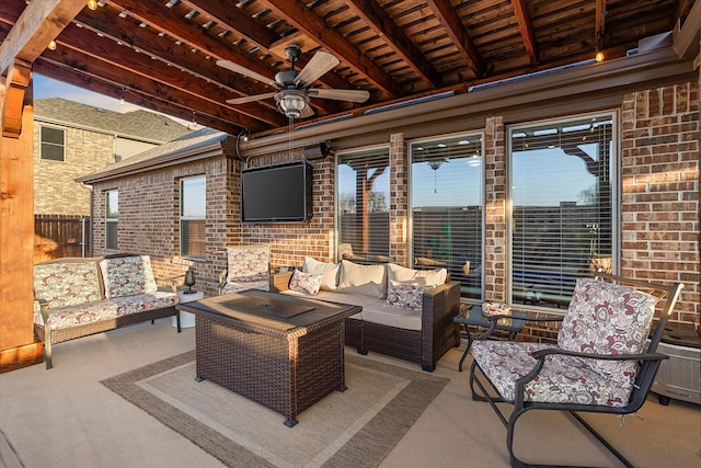 view of patio / terrace featuring ceiling fan, fence, and an outdoor hangout area