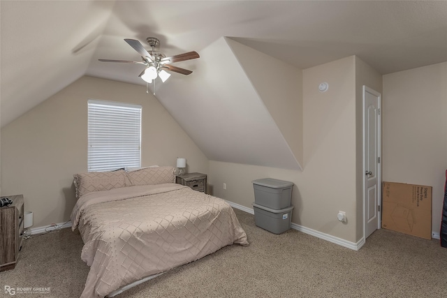 bedroom featuring carpet floors, vaulted ceiling, baseboards, and a ceiling fan