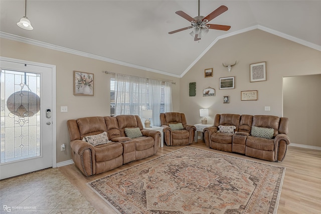 living area with crown molding, light wood-type flooring, vaulted ceiling, and a ceiling fan