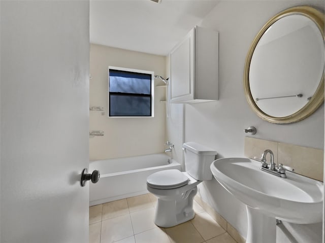 full bathroom featuring bathtub / shower combination, a sink, toilet, and tile patterned floors