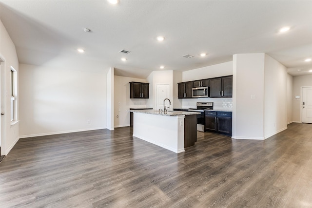 1023 Bedias Rd, Forney, TX 75126 - kitchen featuring dark wood-style flooring, visible vents, appliances with stainless steel finishes, a sink, and an island with sink