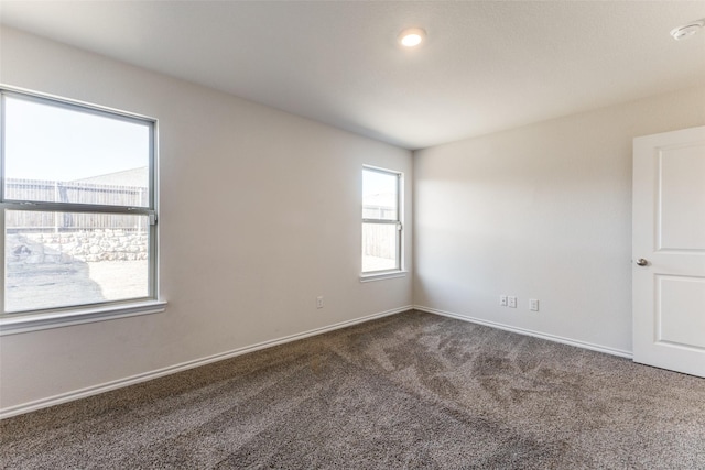 1023 Bedias Rd, Forney, TX 75126 - spare room featuring dark colored carpet and baseboards