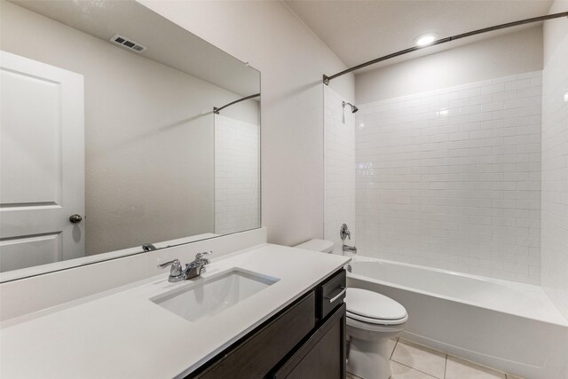 1023 Bedias Rd, Forney, TX 75126 - full bath featuring shower / bath combination, visible vents, toilet, vanity, and tile patterned flooring