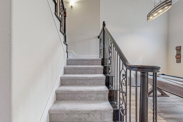 staircase with wood finished floors