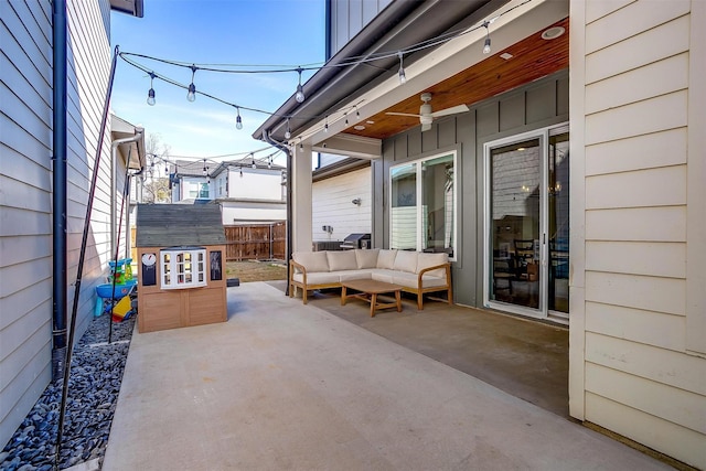 view of patio featuring fence and an outdoor living space