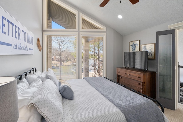 bedroom featuring ceiling fan, vaulted ceiling, a textured ceiling, carpet floors, and recessed lighting