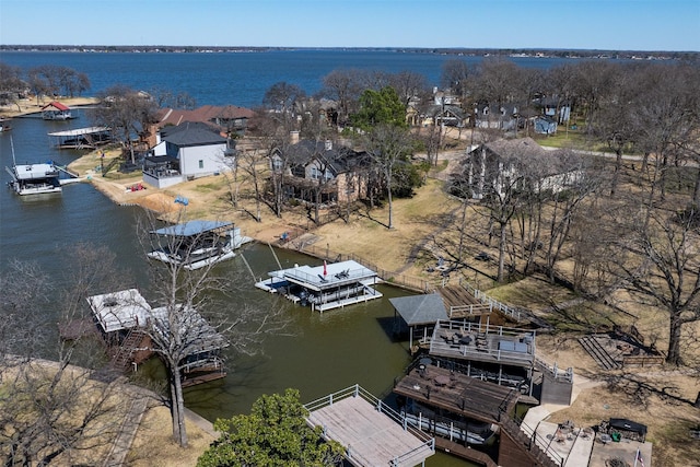 drone / aerial view with a water view and a residential view