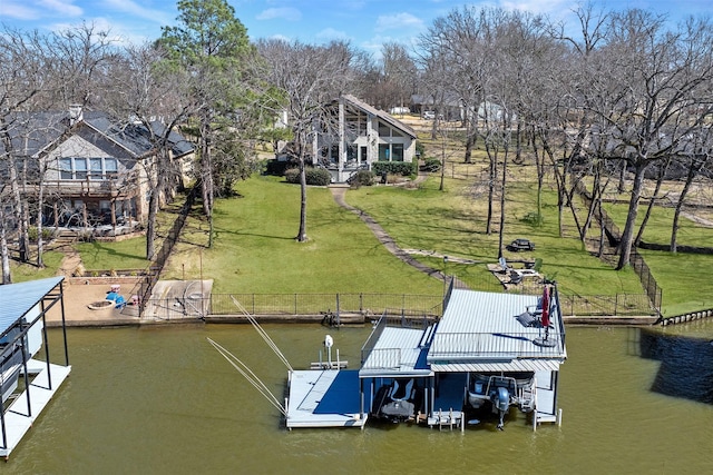 view of dock featuring a yard and a water view