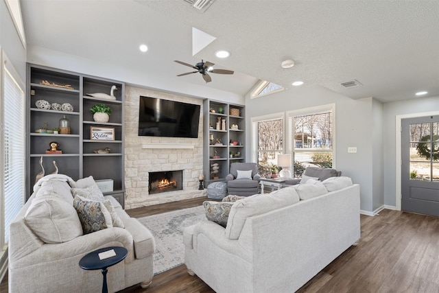 living room with dark wood-style floors, lofted ceiling, and plenty of natural light