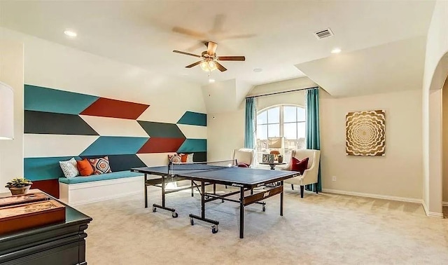 recreation room with baseboards, visible vents, a ceiling fan, lofted ceiling, and carpet