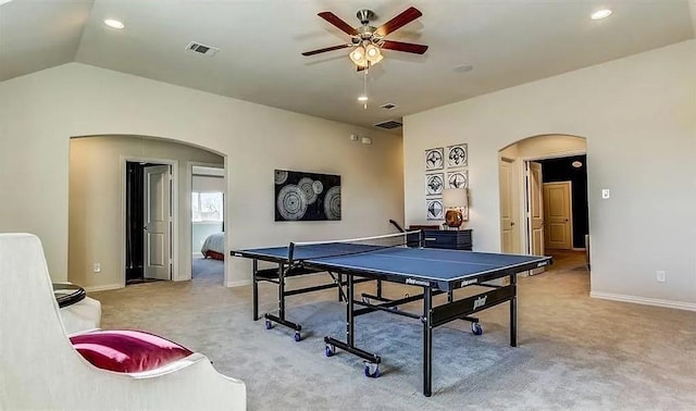 game room featuring arched walkways, vaulted ceiling, carpet, and visible vents