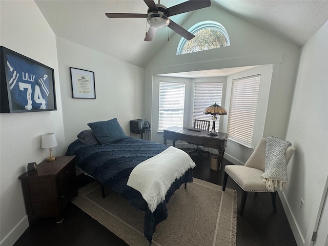 bedroom with lofted ceiling, multiple windows, baseboards, and a ceiling fan