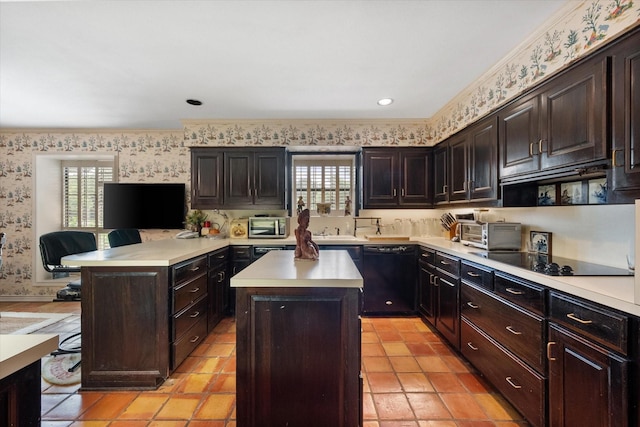 kitchen with wallpapered walls, a kitchen island, light countertops, dark brown cabinets, and black appliances