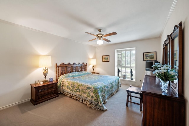 bedroom with a ceiling fan, carpet, crown molding, and baseboards