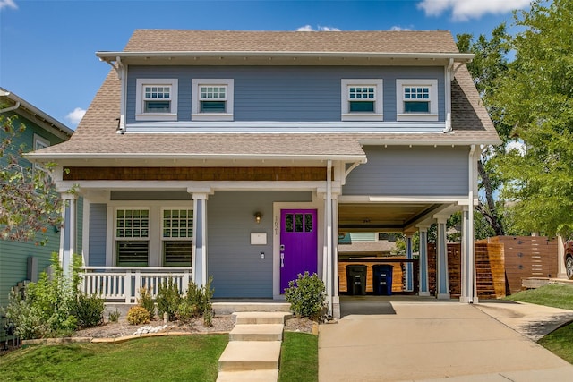 view of front of property with a porch, driveway, a carport, and a shingled roof