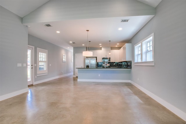 kitchen featuring decorative light fixtures, dark countertops, visible vents, appliances with stainless steel finishes, and white cabinets