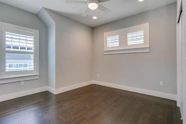 empty room with dark wood-type flooring, recessed lighting, baseboards, and a ceiling fan