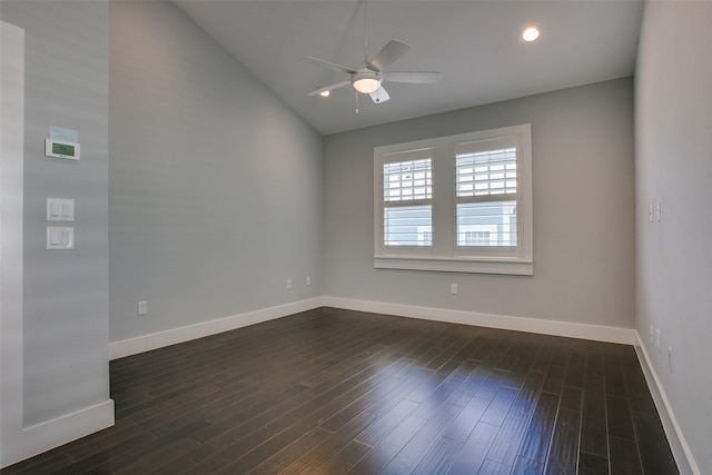 unfurnished room with dark wood-type flooring, baseboards, and a ceiling fan