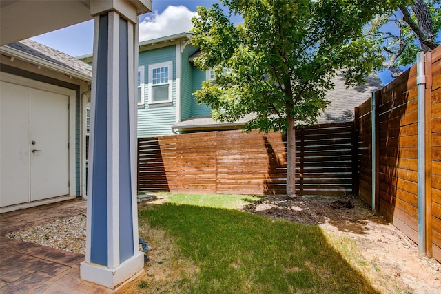 view of yard with a fenced backyard