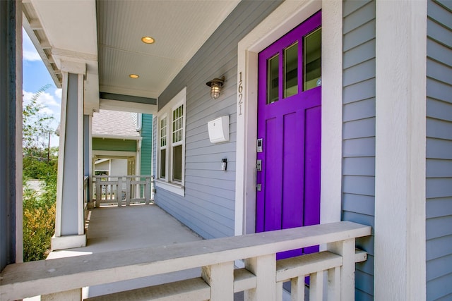 doorway to property with covered porch