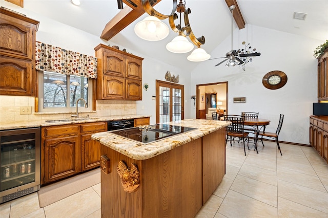 kitchen featuring wine cooler, a kitchen island, brown cabinets, and a sink