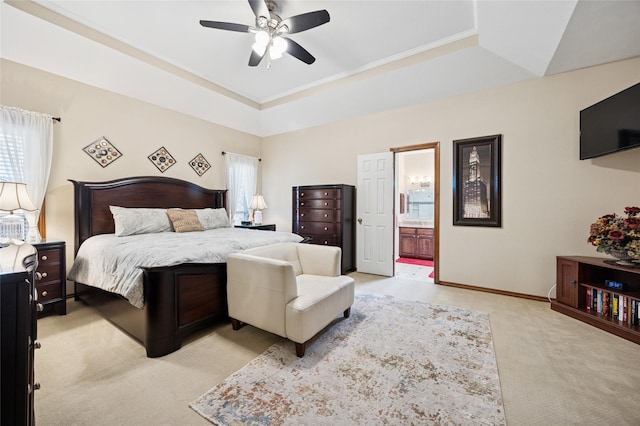 bedroom featuring crown molding, light carpet, ceiling fan, and ensuite bath