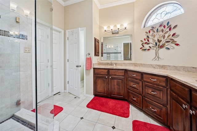 bathroom with ornamental molding, a stall shower, vanity, and tile patterned floors