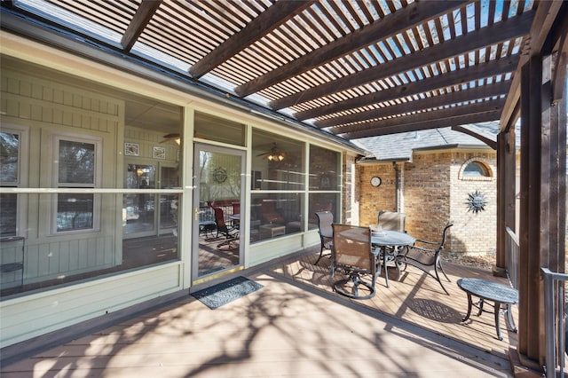 wooden terrace featuring a pergola and outdoor dining space